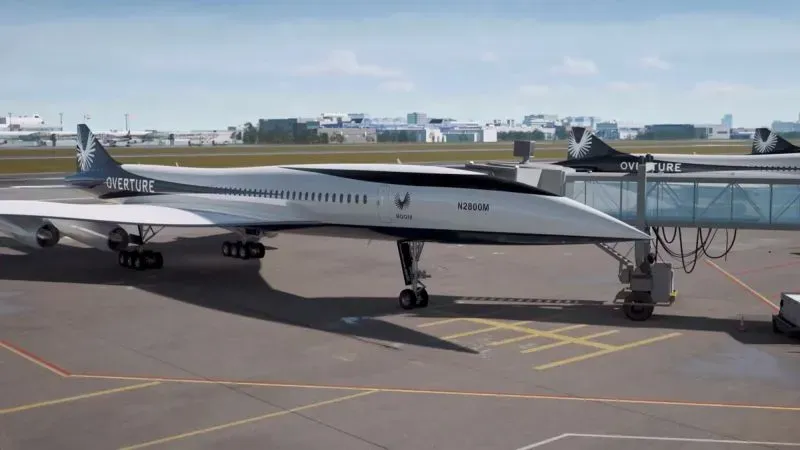 طائرة Overture الأسرع من الصوت في مطار، مصممة لتقليل زمن الرحلات العابرة للقارات إلى النصف، مع مقاعد فاخرة لراحة الركاب.