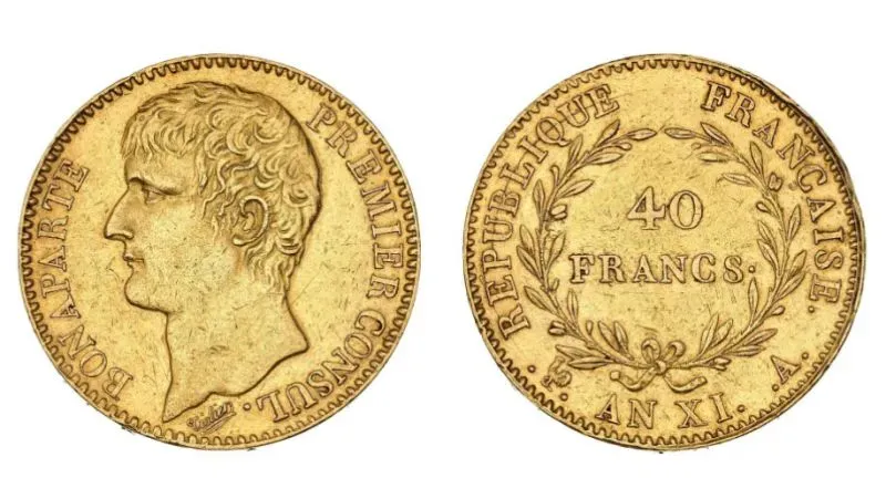 عملة ذهبية فرنسية تعود لعهد نابليون بونابرت، تظهر وجهه على أحد الجانبين، مع تفاصيل دقيقة حول القيمة والتاريخ.